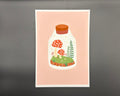A5 art print featuring mushroom terrarium on a pink background with white border.  