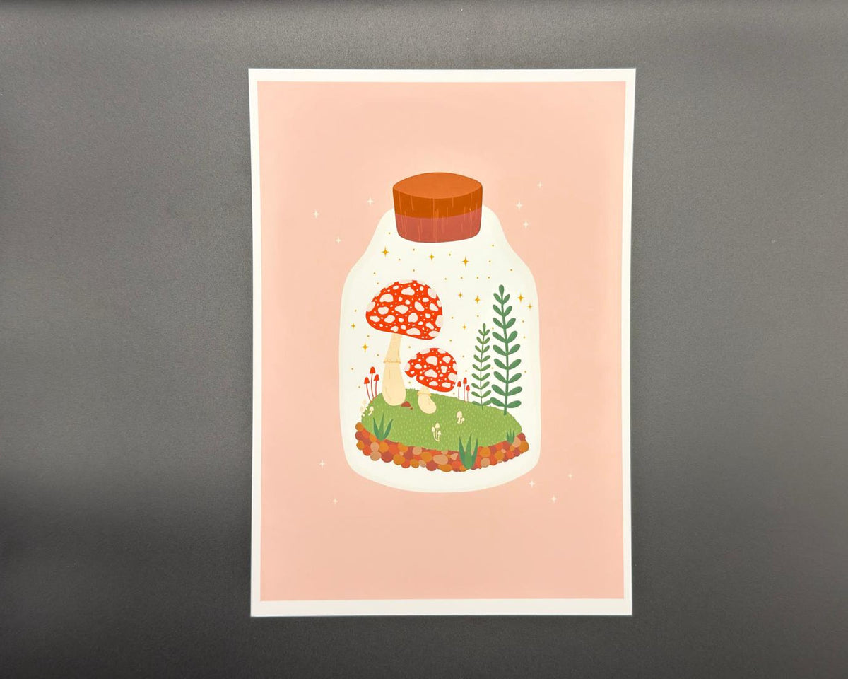 A5 art print featuring mushroom terrarium on a pink background with white border.  
