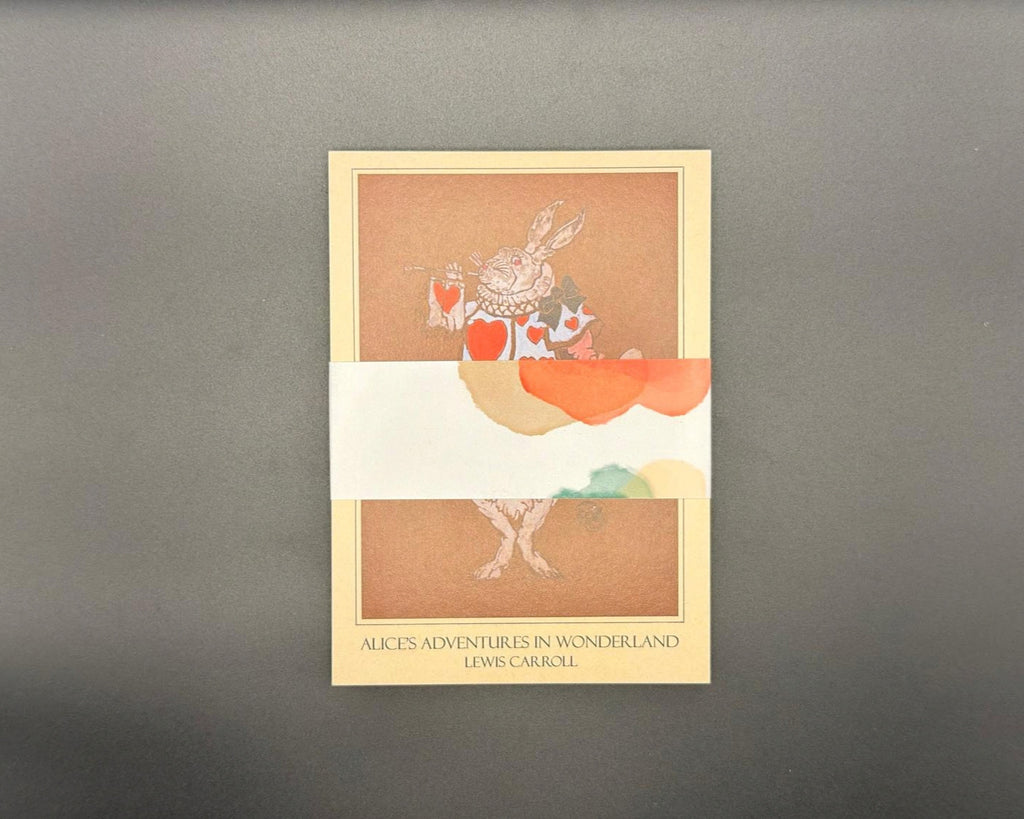 Set of 12 literary postcards held together with a pastel and white belly band. 