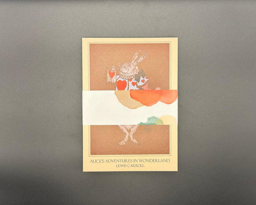 Set of 12 literary postcards held together with a pastel and white belly band. 