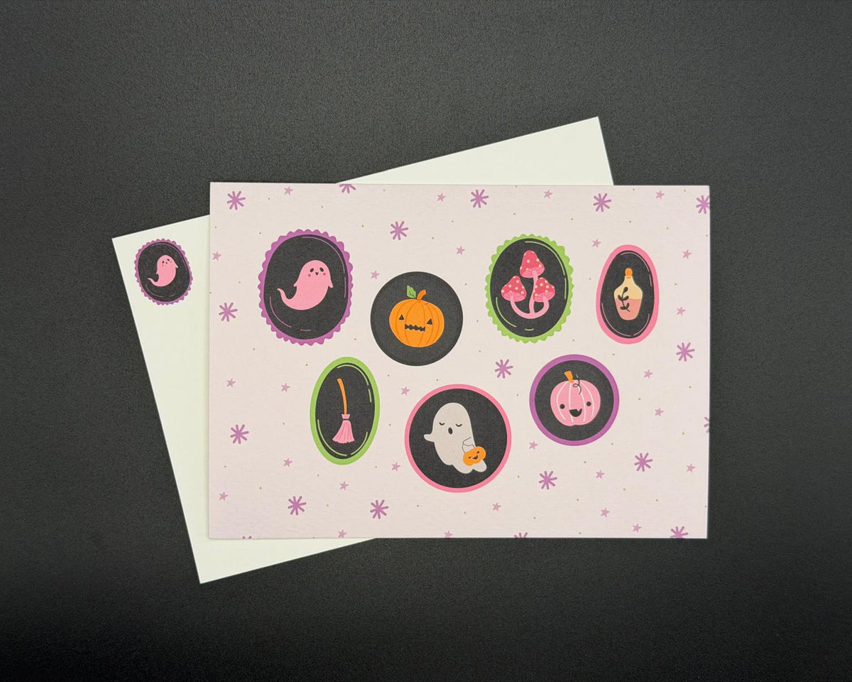 A6 landscape postcard with cute characters (ghost, pumpkin, mushrooms, broomstick, ghost and lantern) in oval shapes on a pink background. 